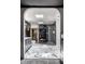 Bright bathroom with marble flooring, a glass shower, and a wooden sauna for a spa-like experience at 6164 Afton Crest, Indianapolis, IN 46220