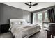 A stylish bedroom with a ceiling fan, balcony access, and contemporary furnishings at 6164 Afton Crest, Indianapolis, IN 46220