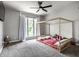 Spacious bedroom features a large window, neutral color scheme, and a fun four poster bed at 6164 Afton Crest, Indianapolis, IN 46220