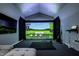Home entertainment room equipped with golf simulator and a large screen at 6164 Afton Crest, Indianapolis, IN 46220