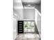 An open-concept entryway with view of front door, large window and staircase leading to the second floor at 6164 Afton Crest, Indianapolis, IN 46220