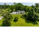 Contemporary home nestled amidst lush greenery and a golf course, offering a serene and private setting at 6164 Afton Crest, Indianapolis, IN 46220