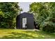 Secluded home nestled among trees with a well-maintained lawn at 6164 Afton Crest, Indianapolis, IN 46220