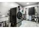 Well-equipped laundry room with modern washer/dryer, utility sink, and ample storage space at 6164 Afton Crest, Indianapolis, IN 46220