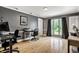 Bright home office with hardwood floors, large windows, and neutral wall color at 6164 Afton Crest, Indianapolis, IN 46220