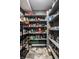 Walk-in pantry features ample shelving, organized storage, and tiled flooring at 6164 Afton Crest, Indianapolis, IN 46220