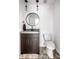 Modern powder room with a round mirror, unique vanity, and neutral decor at 6164 Afton Crest, Indianapolis, IN 46220