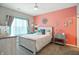 Bright bedroom featuring coastal decor, a ceiling fan, and soft, neutral carpeting at 6315 Emerald Field Way, Indianapolis, IN 46221