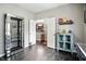 Bedroom featuring neutral walls, access to additional rooms, and a display cabinet at 6315 Emerald Field Way, Indianapolis, IN 46221