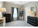 Bedroom featuring neutral walls, a window, and an ornate accent cabinet at 6315 Emerald Field Way, Indianapolis, IN 46221