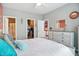 Bedroom featuring a walk-in closet, an ensuite bathroom, and neutral color scheme at 6315 Emerald Field Way, Indianapolis, IN 46221