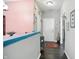 Hallway with modern lighting, neutral paint, and hardwood floors that add a touch of sophistication at 6315 Emerald Field Way, Indianapolis, IN 46221