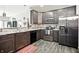 Spacious kitchen featuring stainless steel appliances, granite countertops, and ample cabinet storage at 6315 Emerald Field Way, Indianapolis, IN 46221