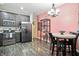 Well-equipped kitchen featuring stainless steel appliances and a comfortable dining area at 6315 Emerald Field Way, Indianapolis, IN 46221