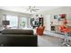 Spacious living room with a ceiling fan, a cozy seating area, and sliding doors to the backyard at 6315 Emerald Field Way, Indianapolis, IN 46221
