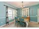 Charming dining room with wainscoting, chandelier, and a hutch, perfect for Gathering gatherings at 6683 Manchester Dr, Fishers, IN 46038