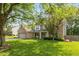 Inviting two-story home with brick and siding, showcasing a well-manicured lawn and traditional architectural details at 6683 Manchester Dr, Fishers, IN 46038