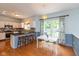 Bright and airy kitchen featuring bar seating, stainless steel appliances, and a charming breakfast nook at 6683 Manchester Dr, Fishers, IN 46038