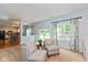 Relaxing living area showcasing natural light, two cozy chairs, and views to the kitchen and backyard at 6683 Manchester Dr, Fishers, IN 46038
