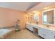 Large main bathroom with dual vanities, a soaking tub, and tile flooring at 6683 Manchester Dr, Fishers, IN 46038