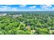 An aerial perspective of the property surrounded by mature trees in the neighborhood at 6949 Crittenden Ave, Indianapolis, IN 46220