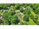An aerial shot of the home and detached garage nestled among mature trees at 6949 Crittenden Ave, Indianapolis, IN 46220