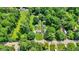 Aerial view of the home and large lot surrounded by mature trees and green space at 6949 Crittenden Ave, Indianapolis, IN 46220