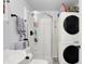 Bathroom with a glass-enclosed shower and a modern washer and dryer at 6949 Crittenden Ave, Indianapolis, IN 46220