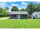 Charming single-story home showcasing a well-maintained lawn and neutral exterior paint at 6949 Crittenden Ave, Indianapolis, IN 46220