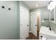 Bathroom with updated vanity, black hardware, and neutral green walls at 7139 Buick Dr, Indianapolis, IN 46214