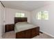 Neutral bedroom features a large bed, side table, and natural light at 7139 Buick Dr, Indianapolis, IN 46214