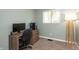 Bedroom with a desk and floor lamp in a cozy setting with neutral colored walls at 7139 Buick Dr, Indianapolis, IN 46214