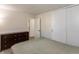 Neutral bedroom features a large bed, side table, and natural light at 7139 Buick Dr, Indianapolis, IN 46214
