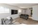 Comfortable living room featuring neutral carpet and gray couches at 7139 Buick Dr, Indianapolis, IN 46214