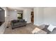 Living room with neutral carpet and view to a kitchen and dining area at 7139 Buick Dr, Indianapolis, IN 46214