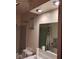 Bathroom with shower/tub combo with neutral tile, pedestal sink, and tiled ceiling at 721 Maplewood Ave, Anderson, IN 46012