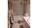 Full bath includes shower with tiled wall and vintage fixtures; ample natural light at 721 Maplewood Ave, Anderson, IN 46012