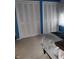 Bedroom featuring a bed, closet, and blue walls at 721 Maplewood Ave, Anderson, IN 46012