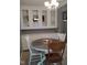 Dining area features a table and chairs with built-in cabinets and decor at 721 Maplewood Ave, Anderson, IN 46012