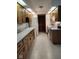 Galley kitchen with white appliances, wood cabinets, and laminate countertops at 721 Maplewood Ave, Anderson, IN 46012