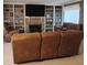 Living room with a brick fireplace, built-in shelves, and comfortable seating at 721 Maplewood Ave, Anderson, IN 46012