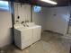 Functional basement laundry area with washer and dryer hookups at 737 Howard St, Shelbyville, IN 46176