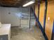 Basement area offers storage shelving and is ready to be finished at 737 Howard St, Shelbyville, IN 46176