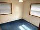 Comfortable bedroom with two windows and wood trim offering ample natural light at 737 Howard St, Shelbyville, IN 46176