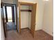 Bright bedroom with open closet and convenient access to the hallway at 737 Howard St, Shelbyville, IN 46176