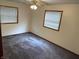 Bright bedroom with neutral carpet and windows, providing a peaceful retreat for rest and relaxation at 737 Howard St, Shelbyville, IN 46176