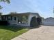 Charming single-story home featuring a well-maintained lawn and convenient detached garage at 737 Howard St, Shelbyville, IN 46176