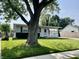 Charming single-story home featuring a well-maintained lawn, cozy entrance, and ample natural light at 737 Howard St, Shelbyville, IN 46176