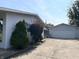 A detached garage with a clean concrete driveway and well-maintained exterior at 737 Howard St, Shelbyville, IN 46176