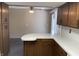 Kitchen and bonus space offers an eat-in bar, plentiful cabinetry, bright countertops, and easy transition to additional room at 737 Howard St, Shelbyville, IN 46176